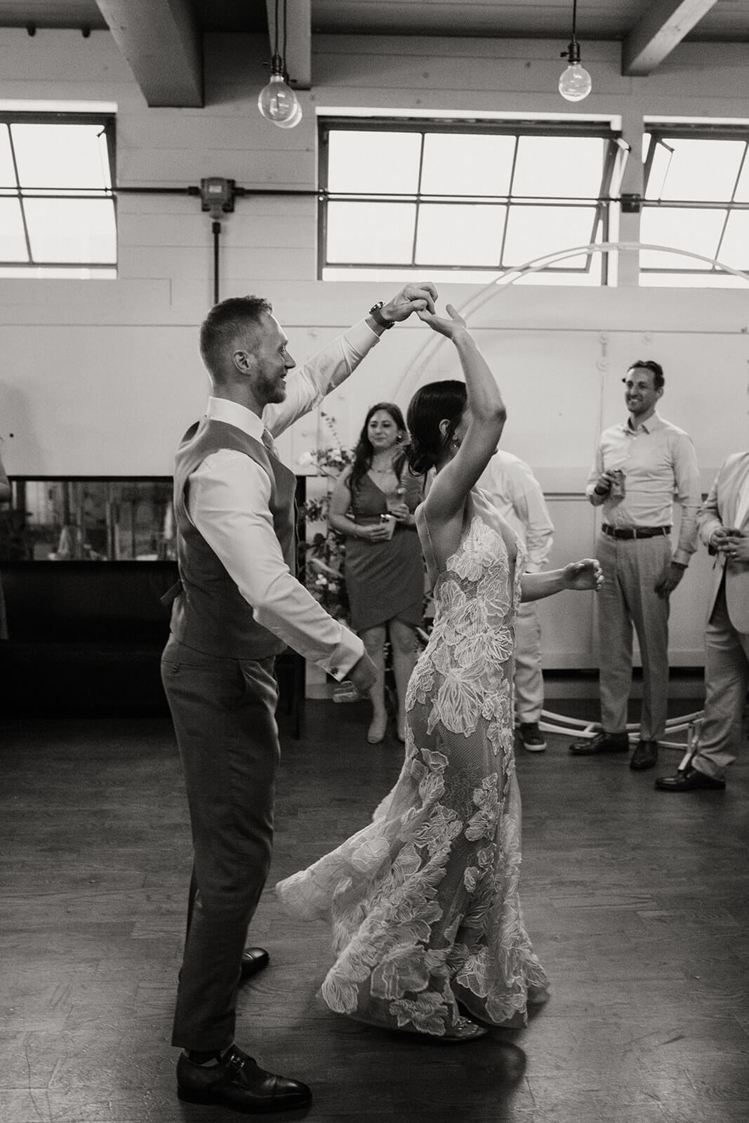 Bride and groom first dance at industrial wedding reception in Seattle