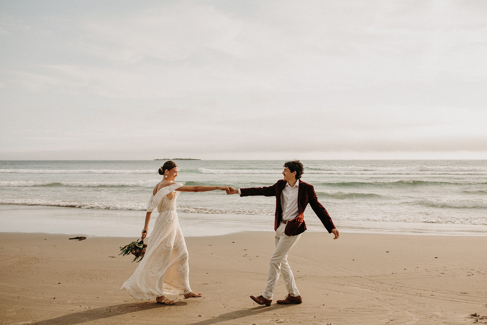 Bride and groom dancing on the beach for their Oregon Coast elopement