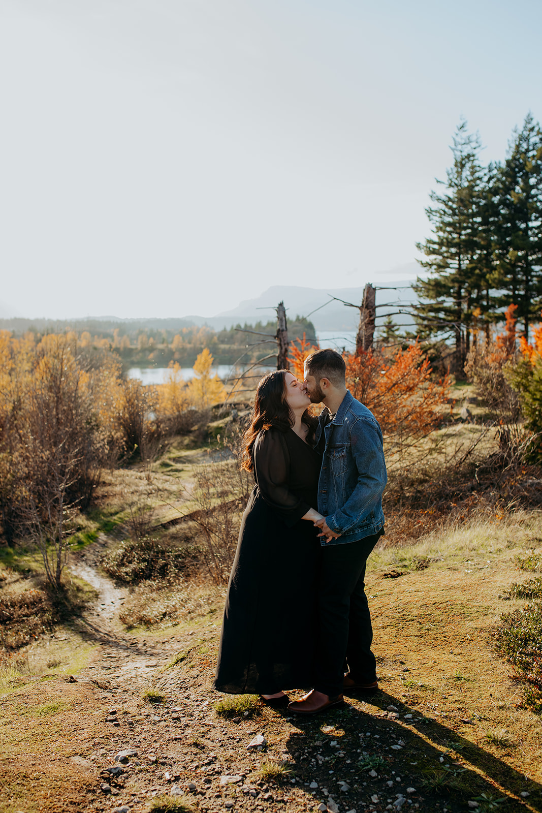 Couple kissing at engagement session at cascade locks