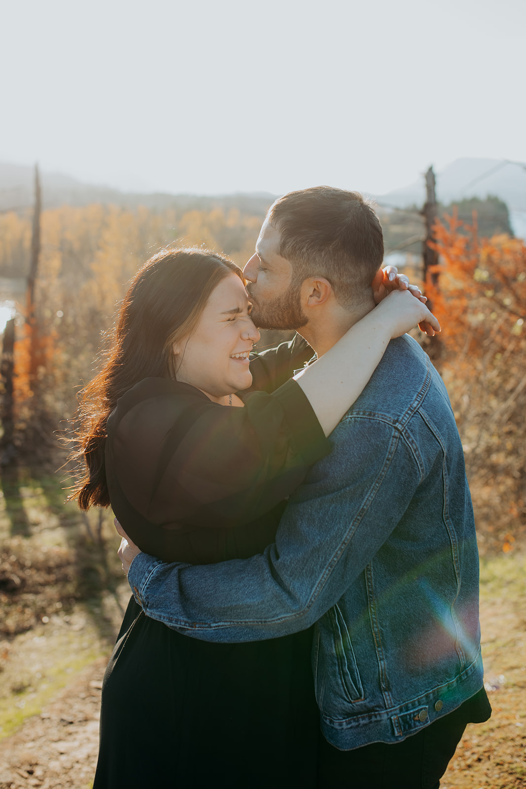 Couple hugging at engagement session at cascade locks