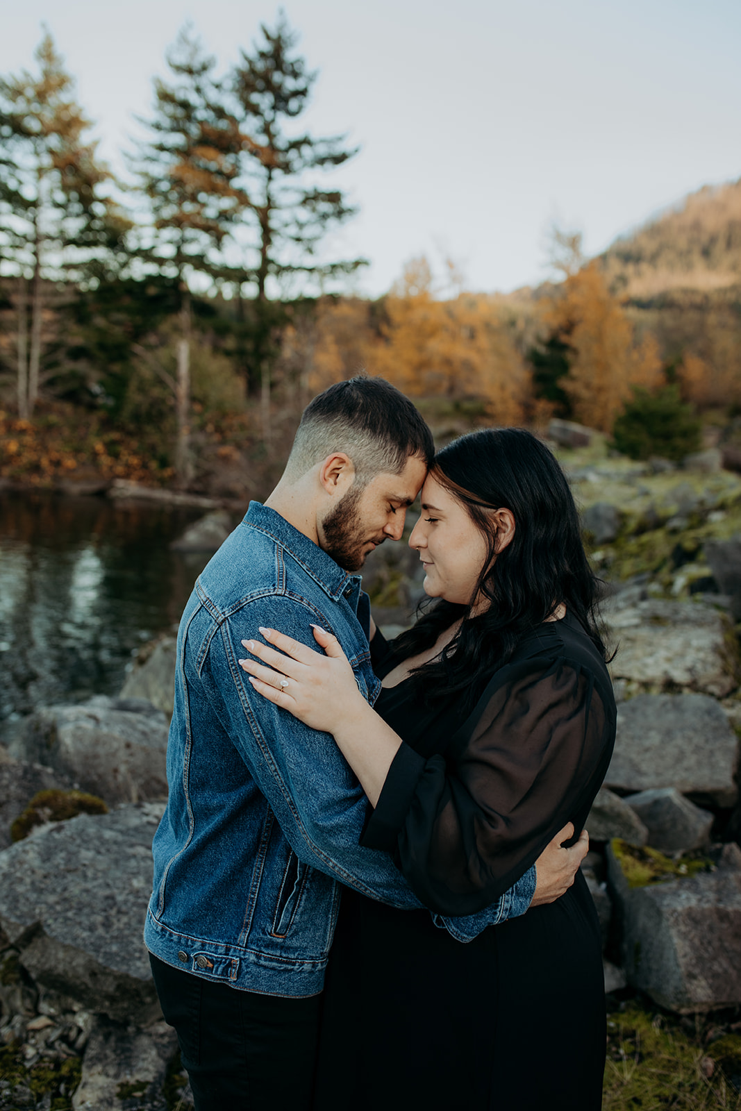Couple embracing at engagement photography session at Cascade Locks