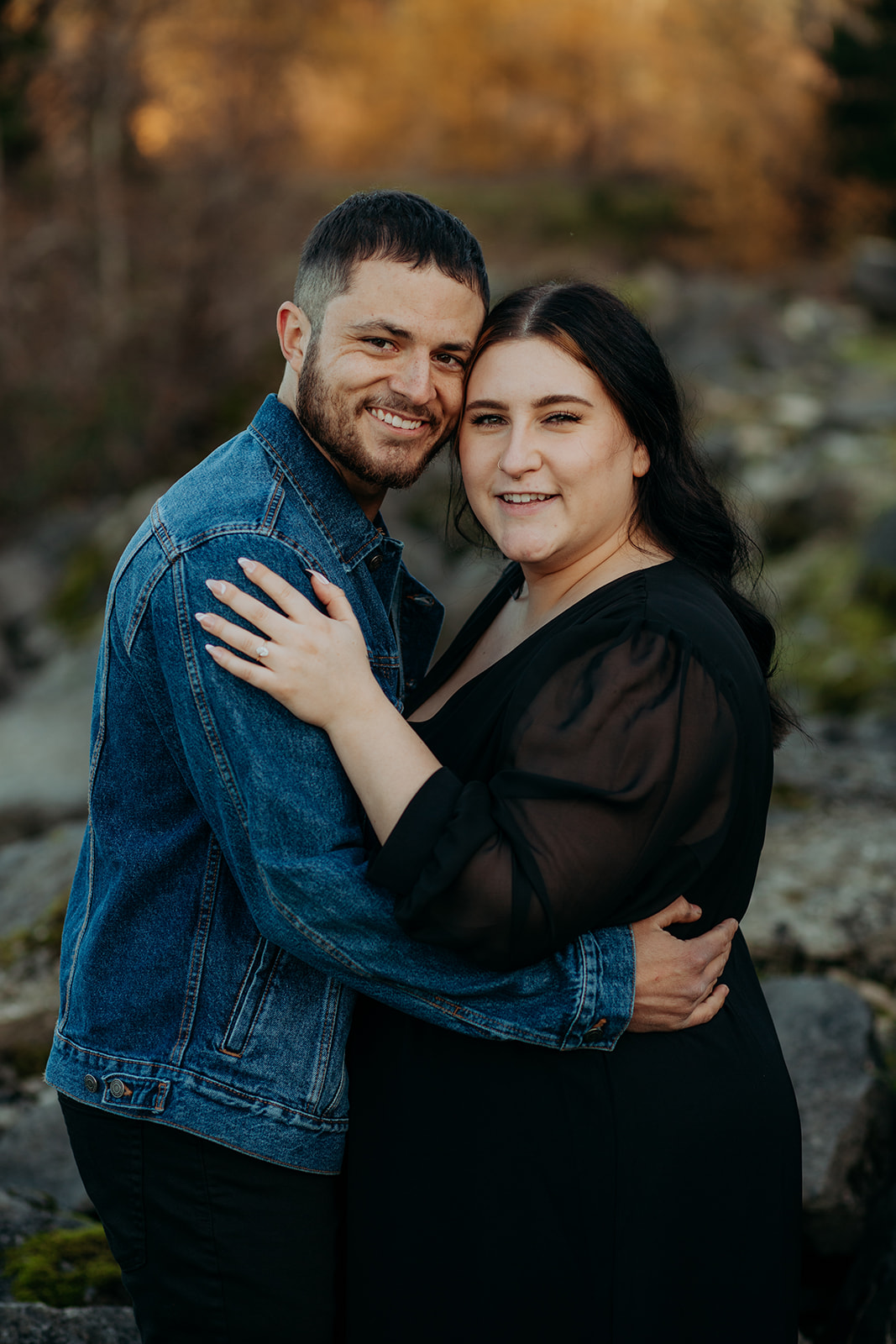Couple hugging at engagement photography session at cascade locks