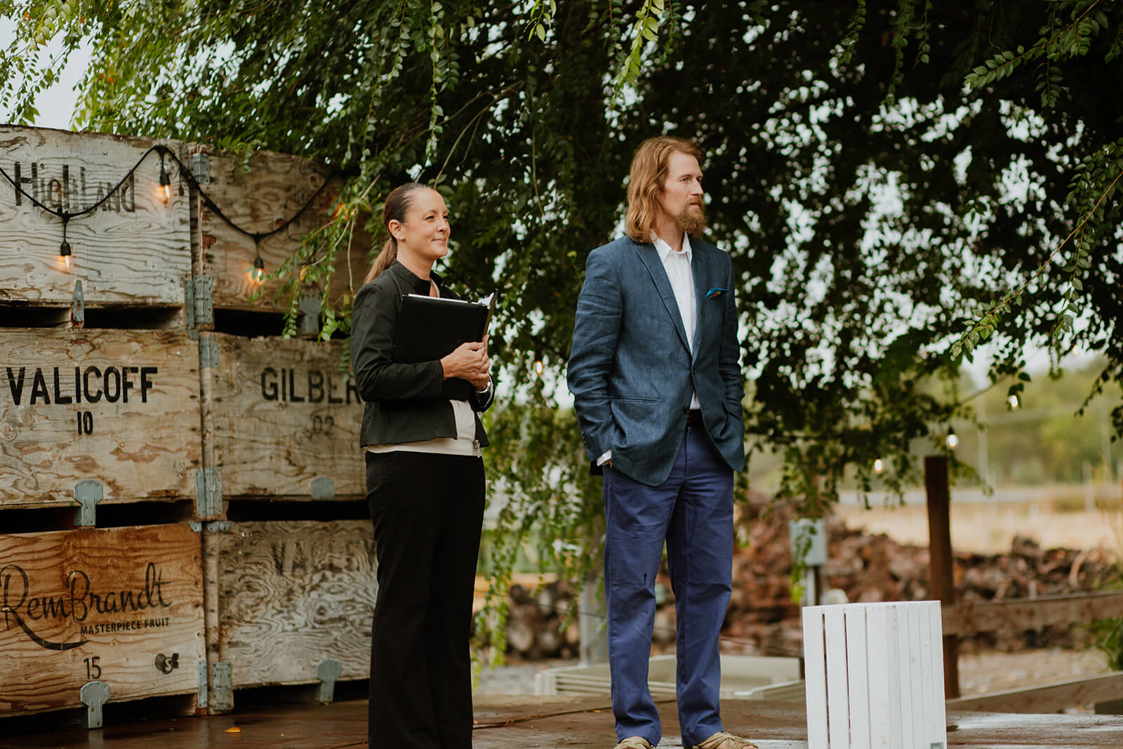 Groom standing at wedding altar with officiant