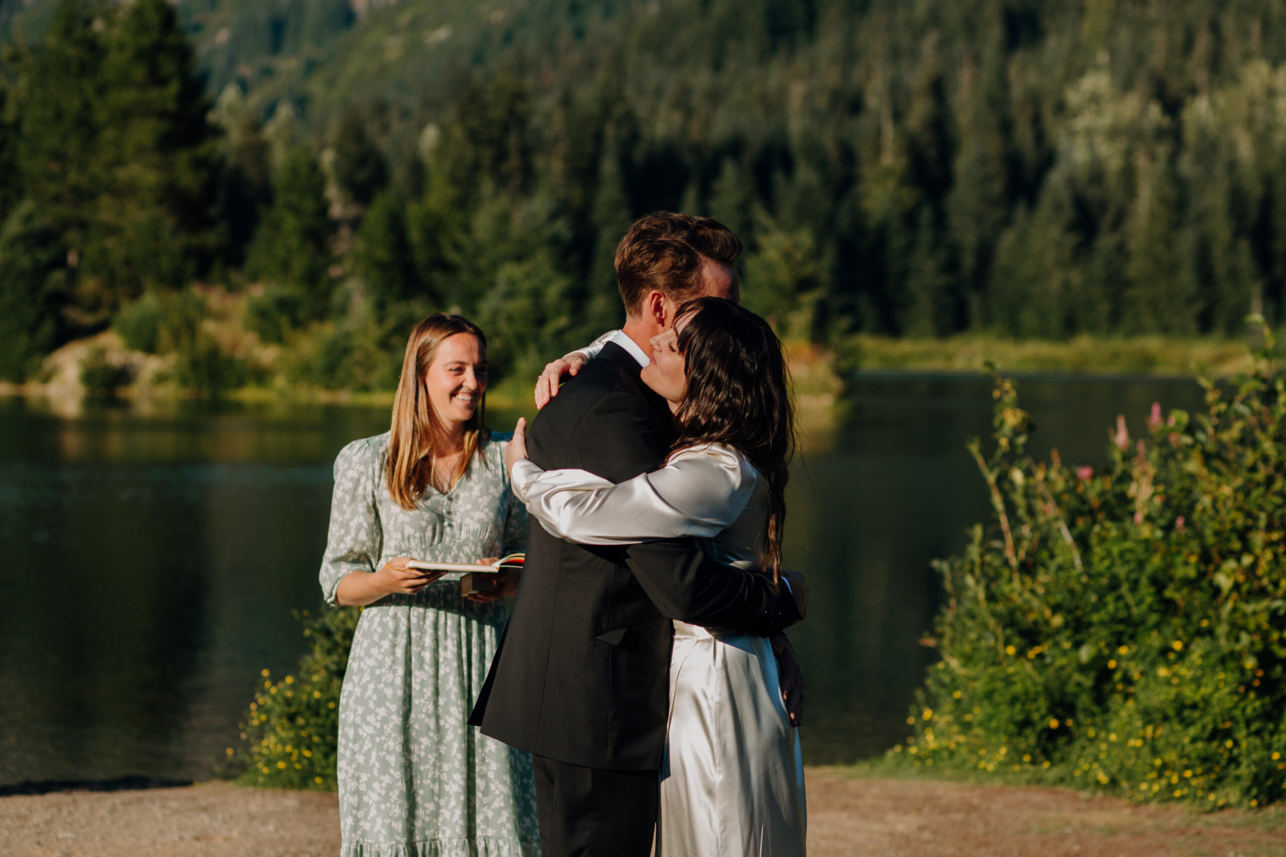Bride and Groom hold each other at Gold Creek Pond 