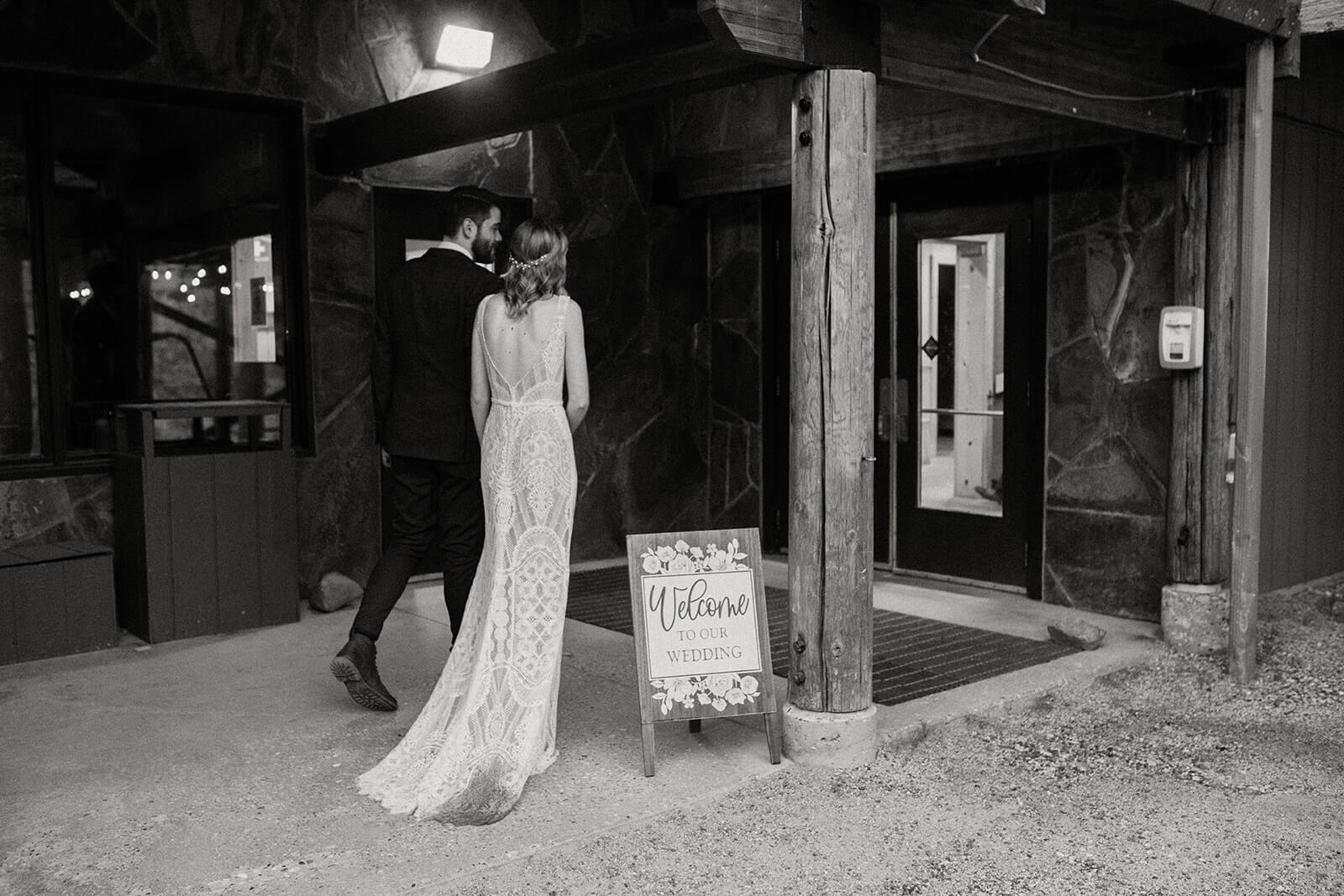 Bride and groom entering reception at ski wedding