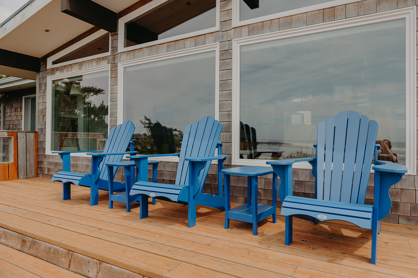 three blue deck chairs on a deck at Yachats, Oregon